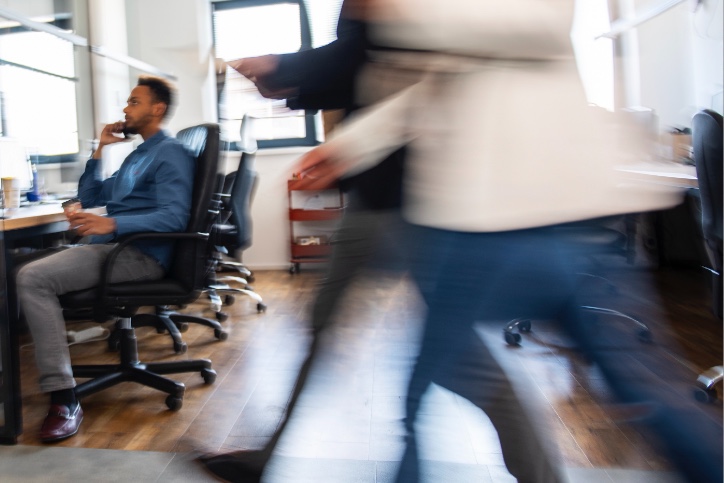 Blurred shot of person walking in office