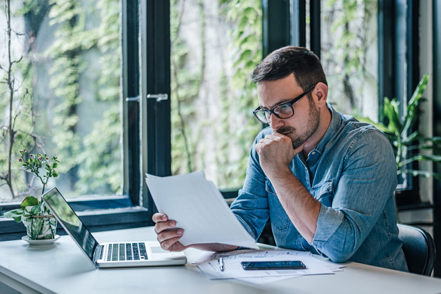 Man at desk doing tax services